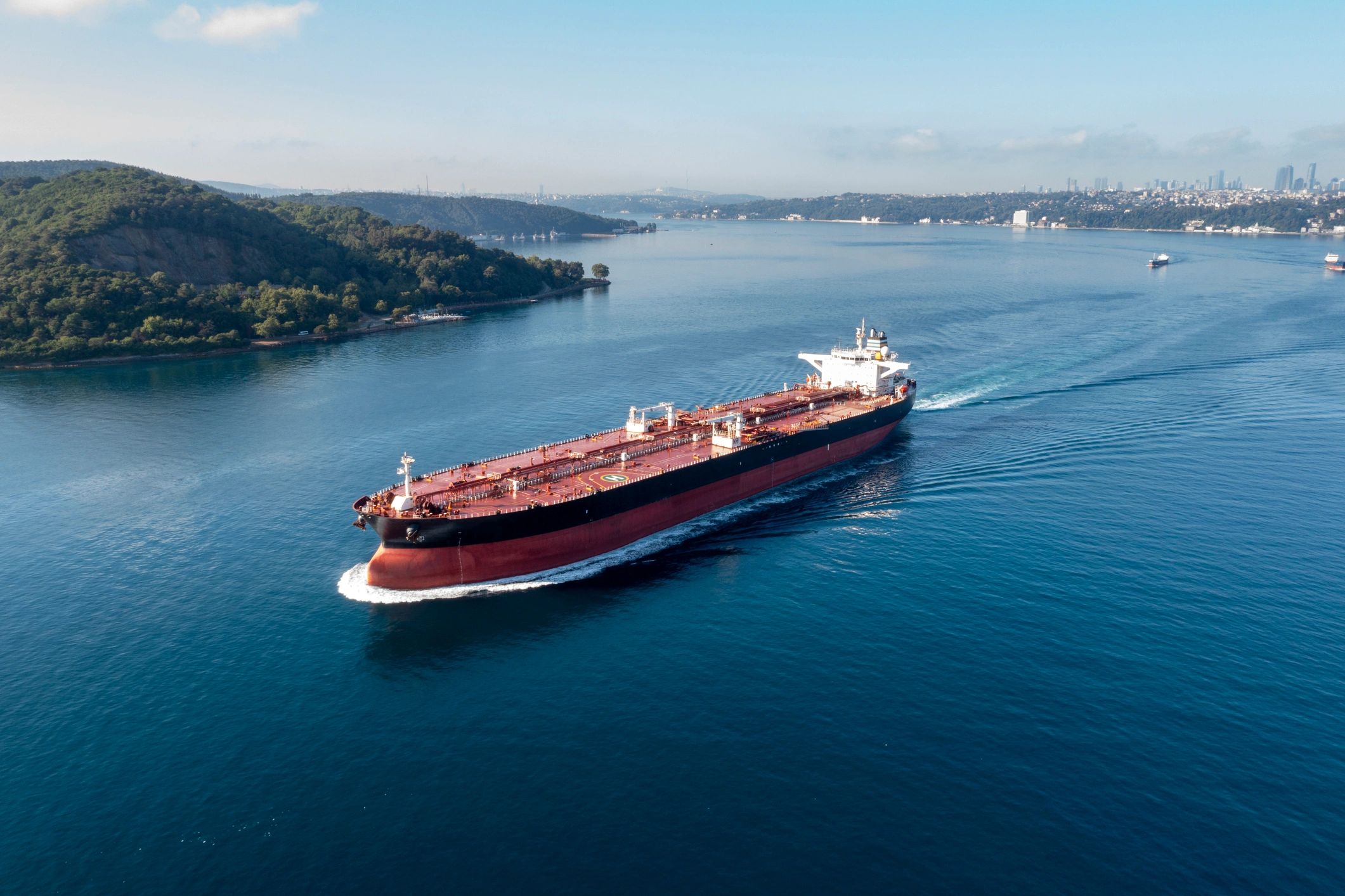 Oil tanker navigating a busy waterway